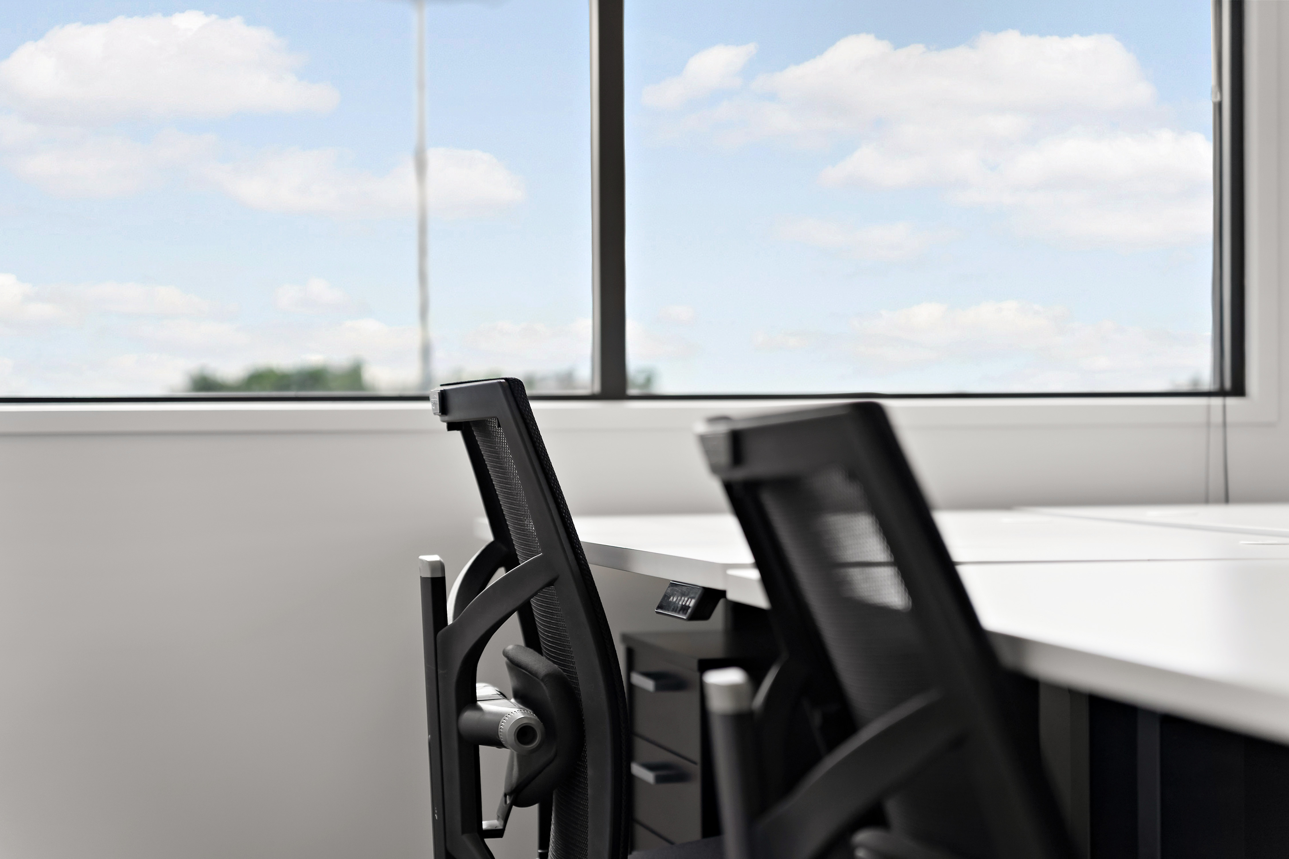 Thinkspace Botany ergonomic black mesh chairs with sky view