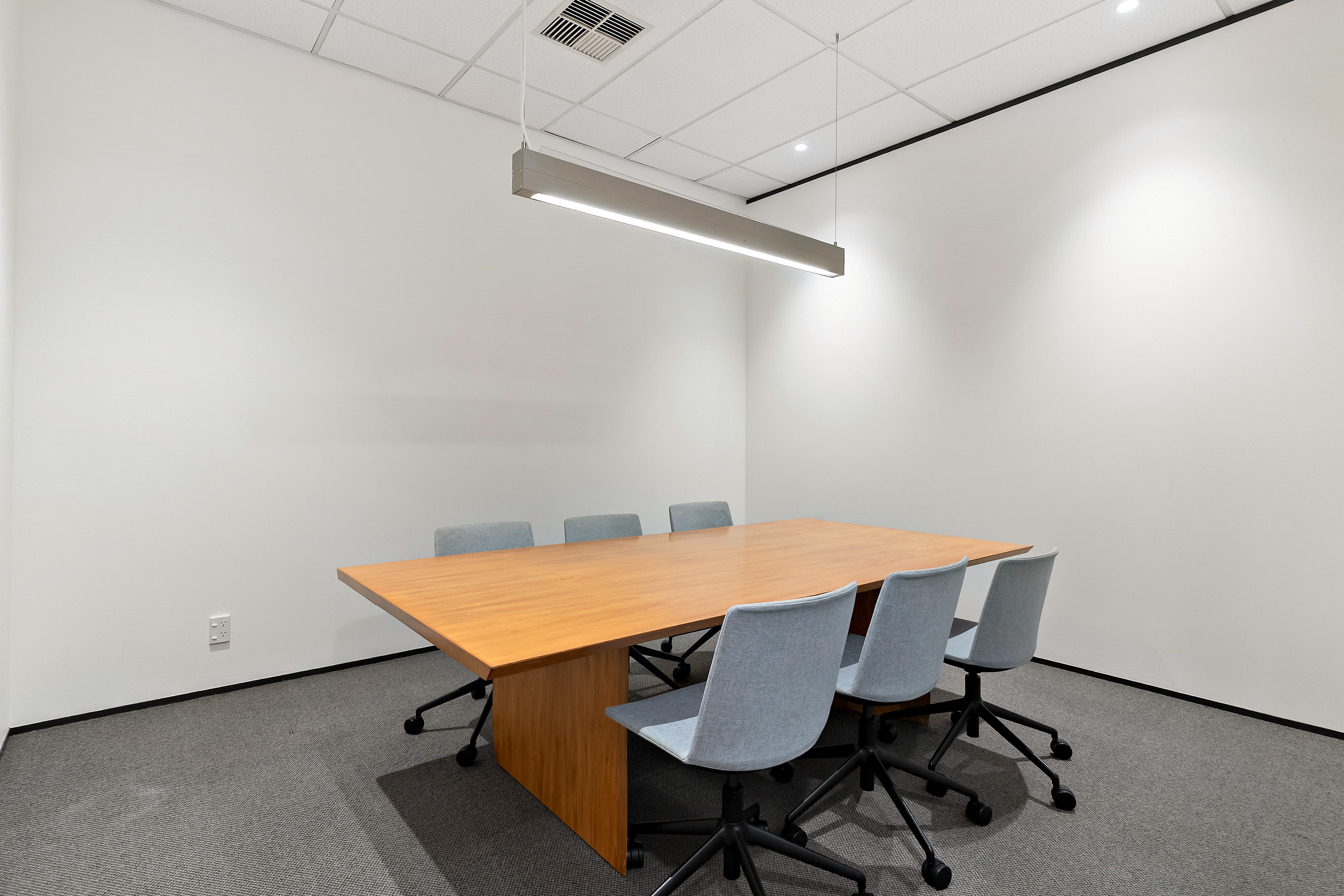 Thinkspace Botany Meeting Room A with wooden table and blue chairs