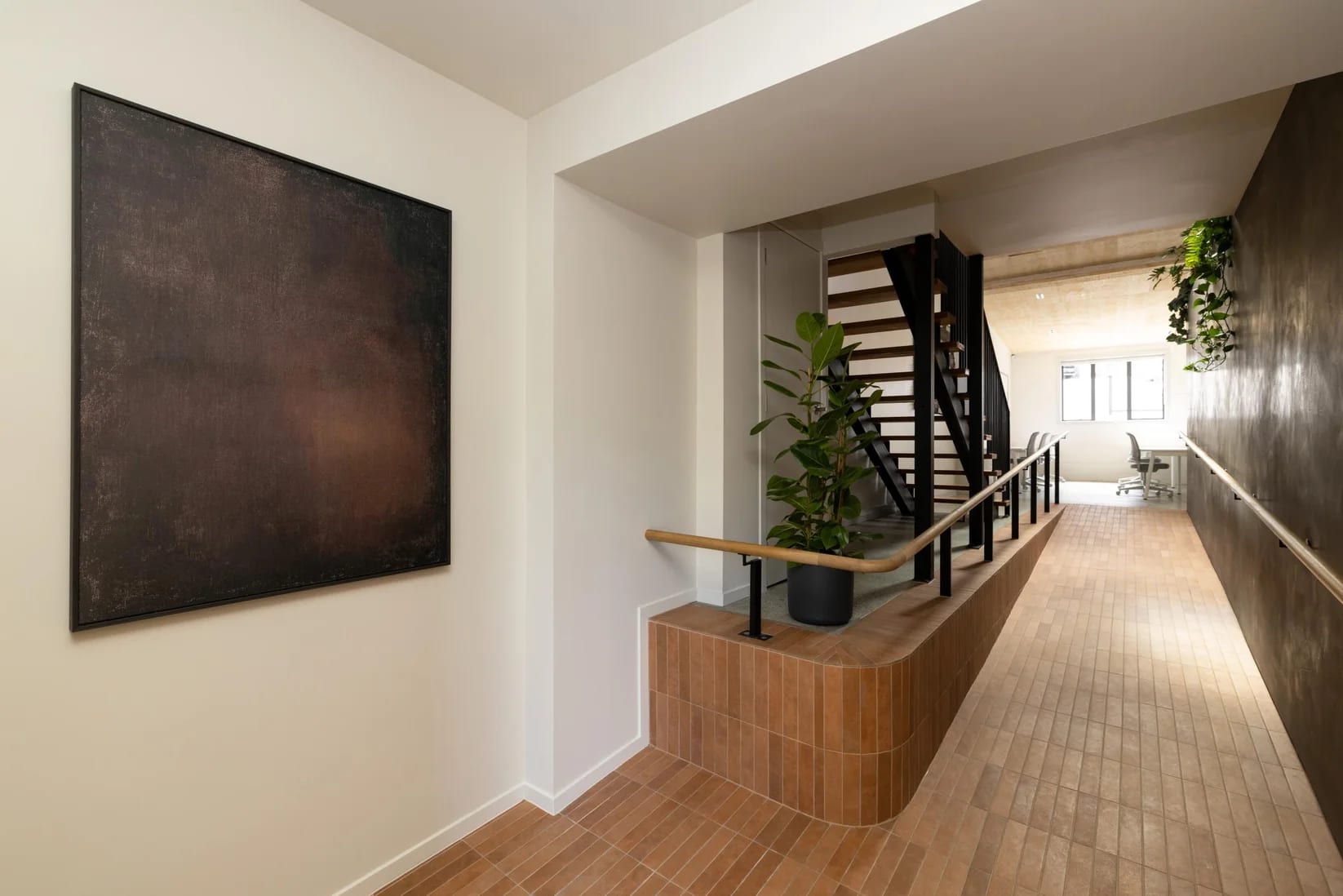 Entrance and reception approach with tiled floor and artwork at Thinkspace Grafton