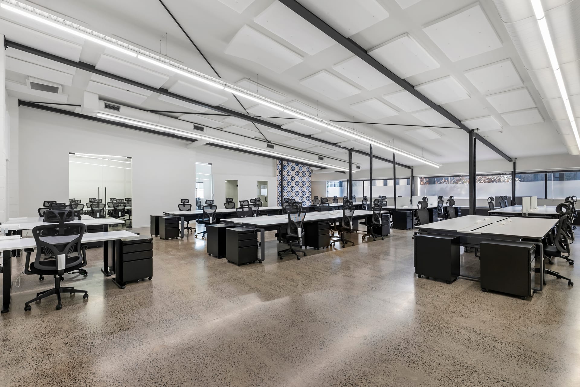 Open-plan dedicated desks across the 600m² floor at Thinkspace Morningside