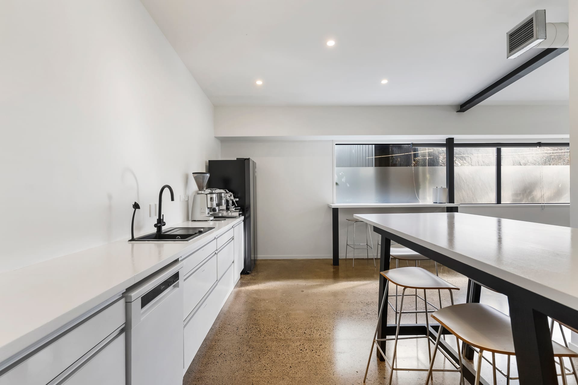 Kitchen and breakout galley with leaner bench at Thinkspace Morningside