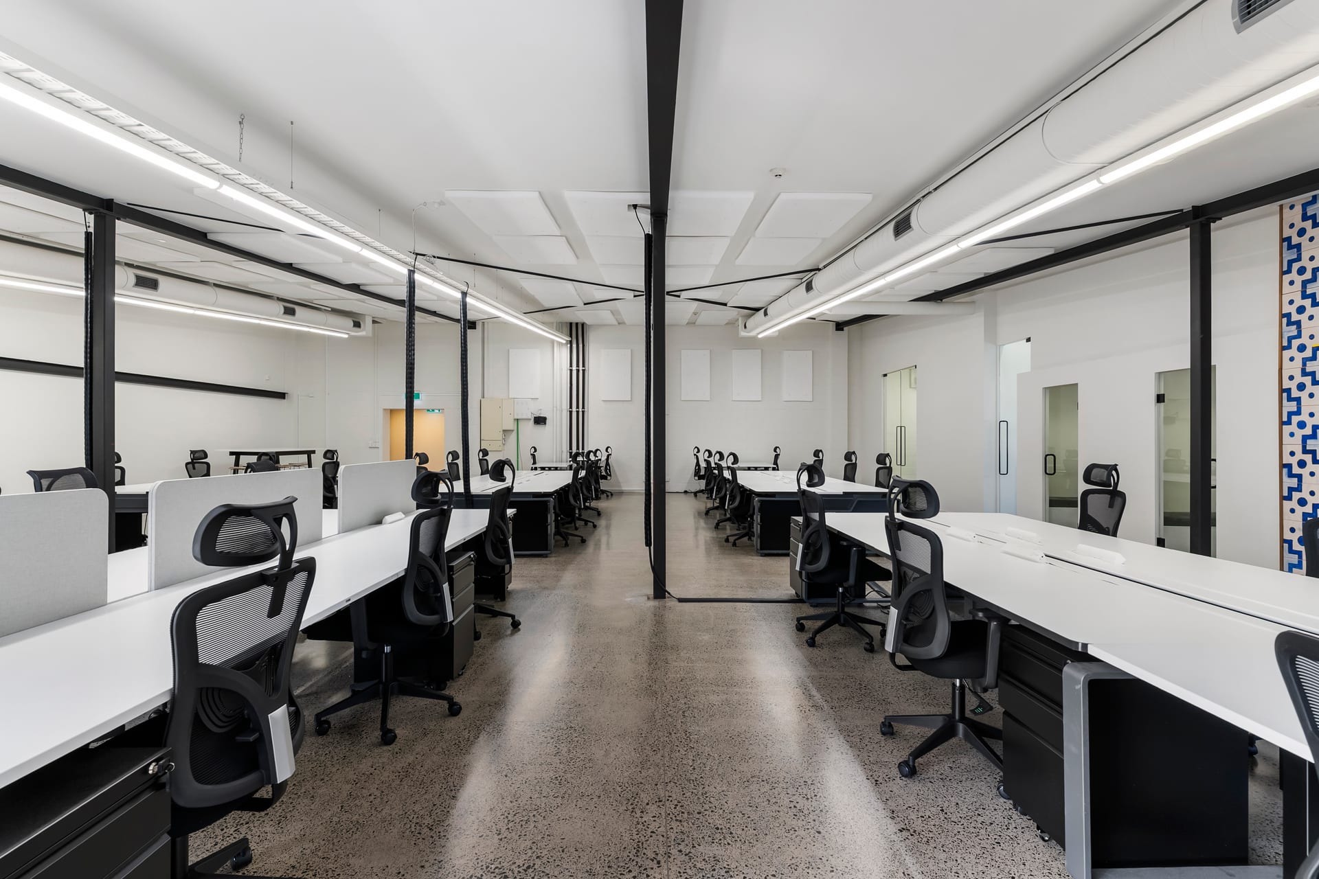 Bright open-plan interior with black steel columns at Thinkspace Morningside