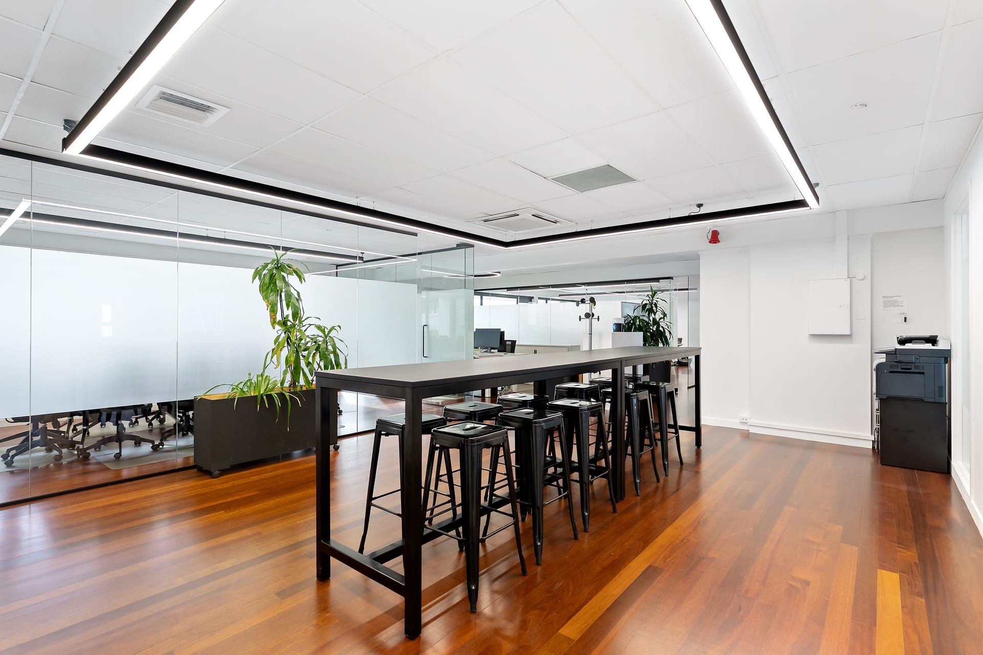 Flexible breakout area with high benches and whiteboard at Thinkspace Parnell